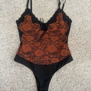 Elegant Black and Orange Lace Bodysuit